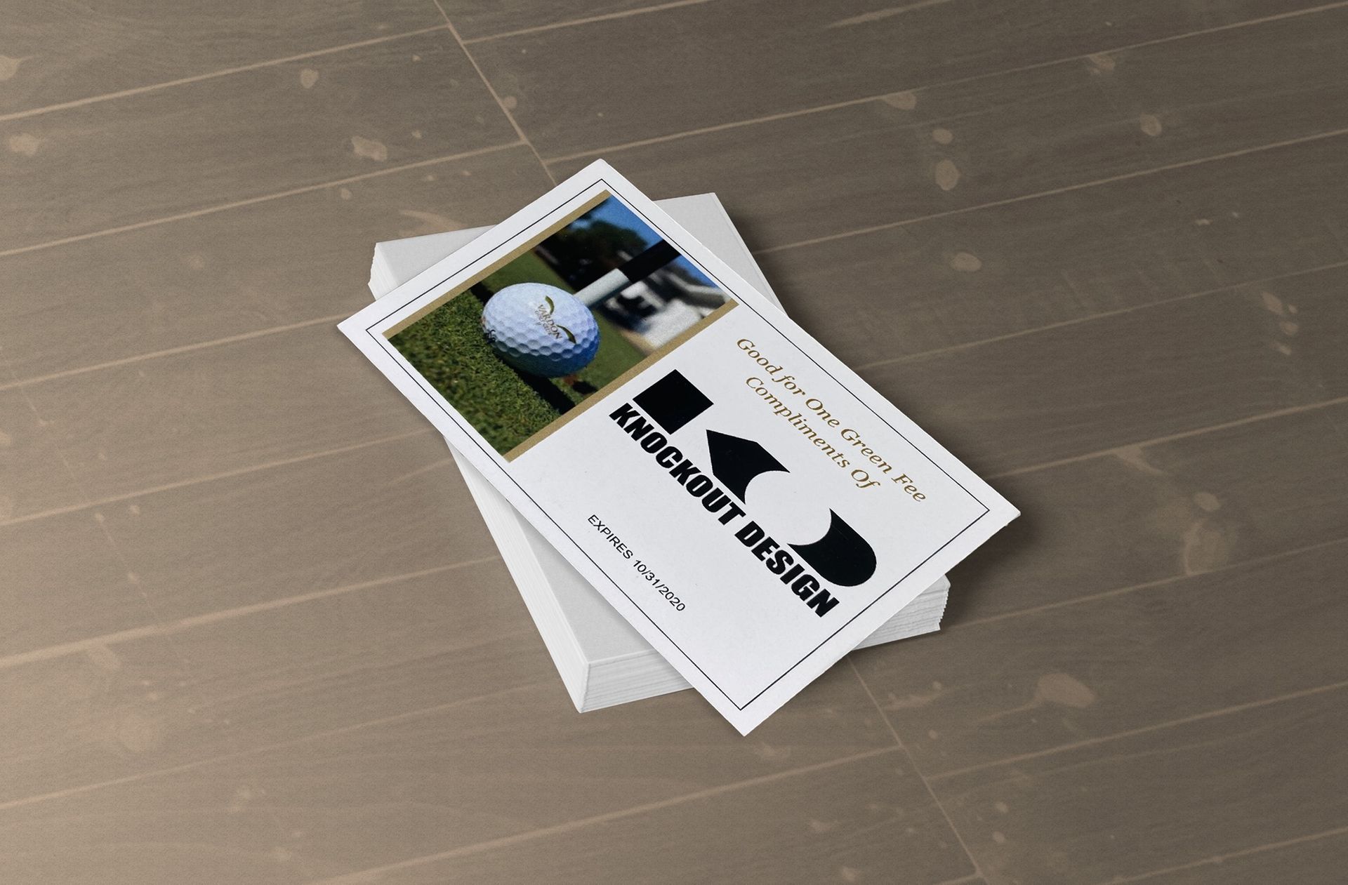 Stack of business cards on a wooden table, one card showing a golf ball and club graphic.