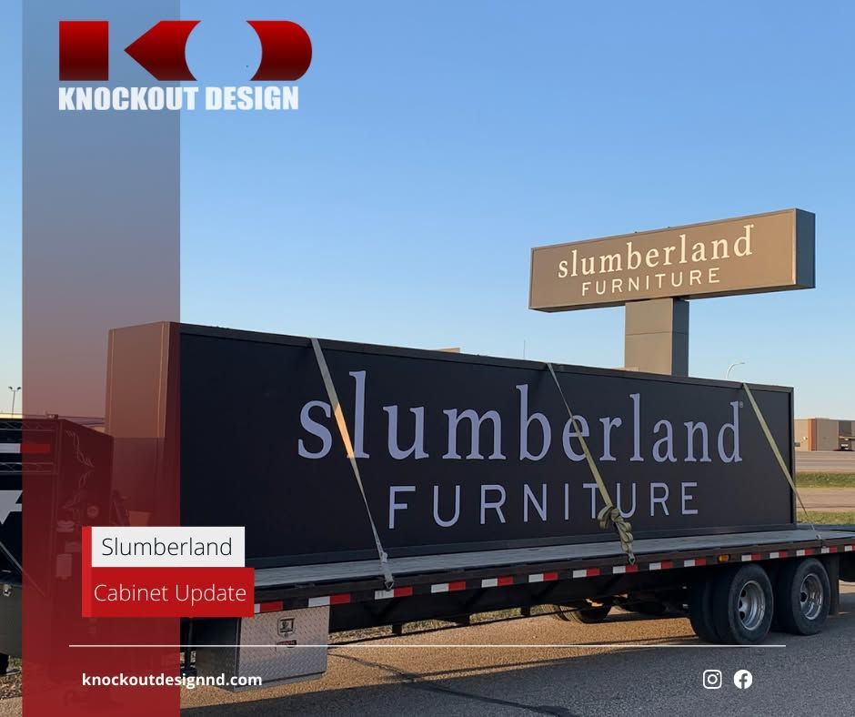 Slumberland Furniture semi-trailer parked outdoors under a blue sky