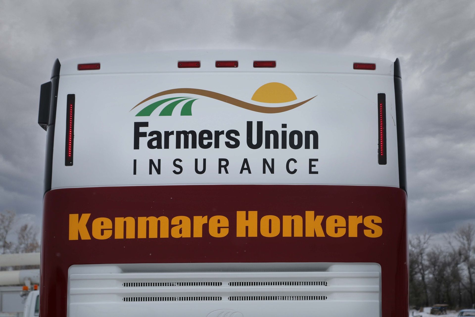 Farmers Union Insurance sign on a white vehicle reading “Kenmare Honkers”