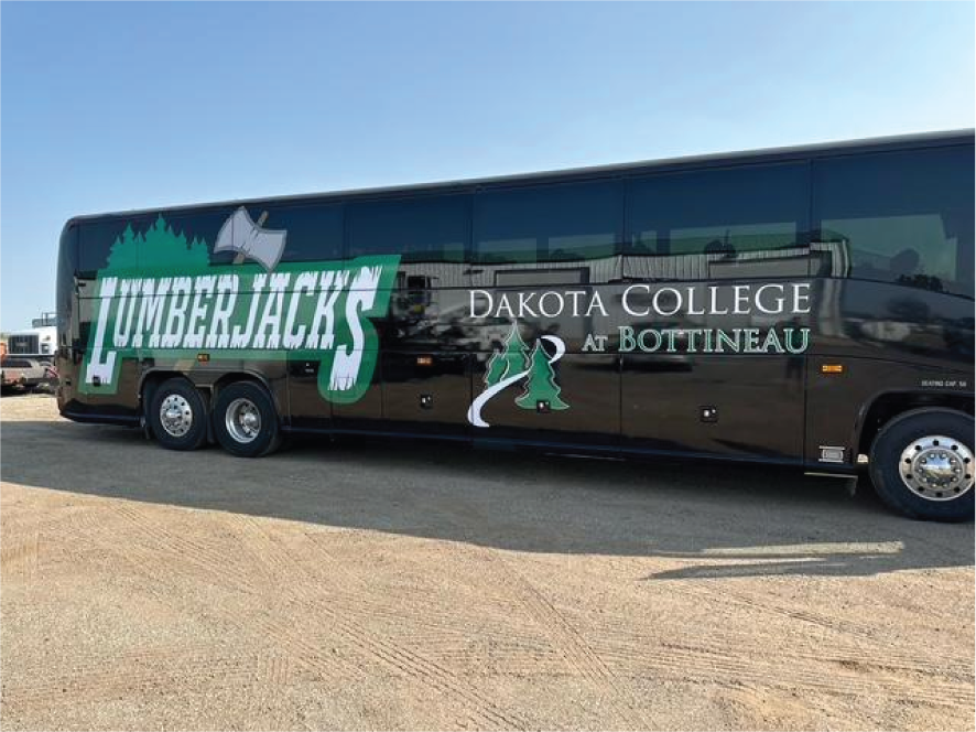 Black Dakota College Bottineau Lumberjacks trailer parked outdoors on a sunny day