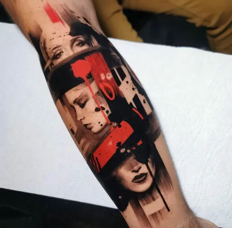 Forearm tattoo featuring three fragmented faces in a surreal, abstract style with bold red and black ink accents.
