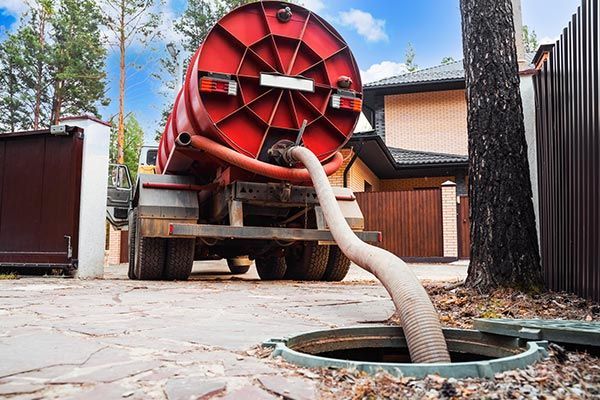 Septic tank system pumping service being performed at a residential property in Frazier Park, CA, wi