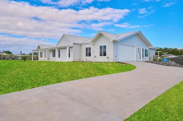 A White House Is Sitting on Top of A Lush Green Hill | Mid-North Coast, NSW | BDM Constructions