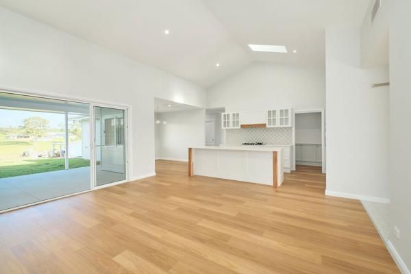 A Living Room with Hardwood Floors and A Kitchen in A House | Mid-North Coast, NSW | BDM Constructions