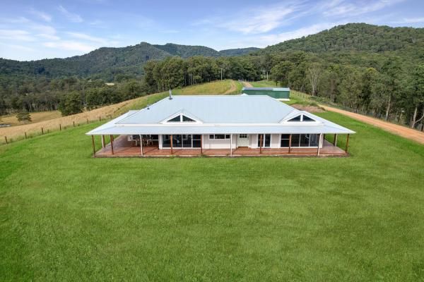 An Aerial View of A Large House in The Middle of A Lush Green Field | Mid-North Coast, NSW | BDM Constructions