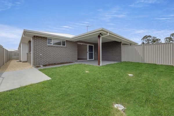 A Brick House with A Large Lawn in Front of It | Mid-North Coast, NSW | BDM Constructions