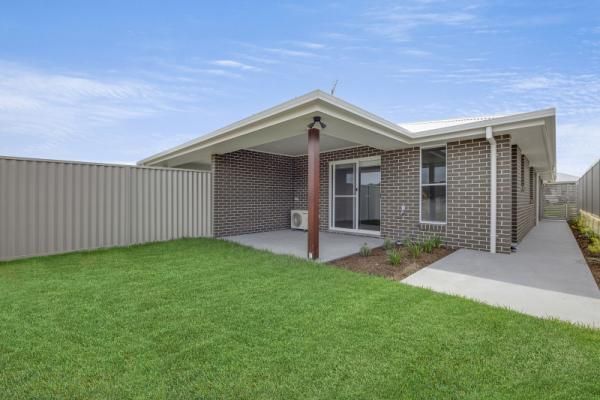 A Brick House with A Large Lawn in Front of It | Mid-North Coast, NSW | BDM Constructions