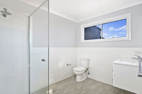 A Bathroom with A Toilet a Sink and A Window | Mid-North Coast, NSW | BDM Constructions