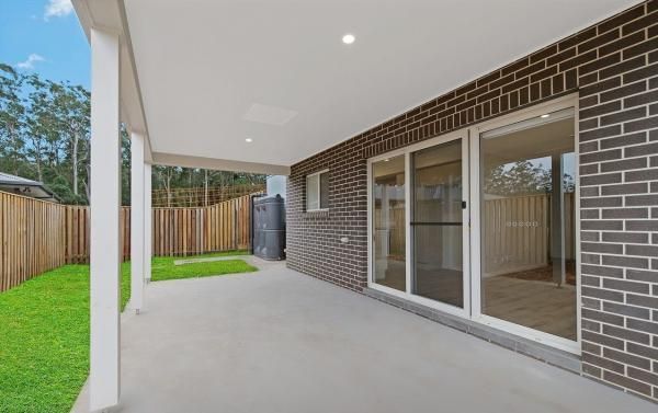 A Brick House with A Patio and Sliding Glass Doors | Mid-North Coast, NSW | BDM Constructions
