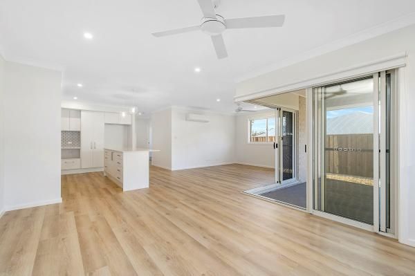 An Empty Living Room with Hardwood Floors and A Ceiling Fan | Mid-North Coast, NSW | BDM Constructions