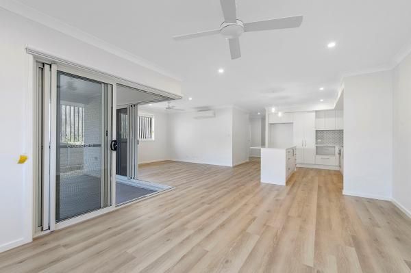 An Empty Living Room with Hardwood Floors and A Ceiling Fan | Mid-North Coast, NSW | BDM Constructions
