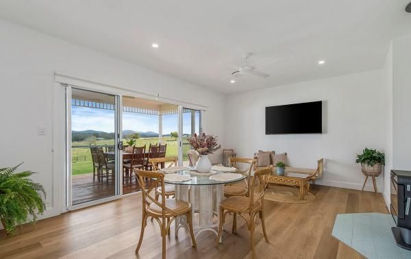 A Living Room with A Table and Chairs and A Flat Screen TV | Mid-North Coast, NSW | BDM Constructions