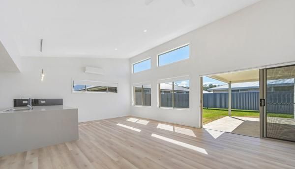 A Living Room with A Lot of Windows and A Sliding Glass Door | Mid-North Coast, NSW | BDM Constructions