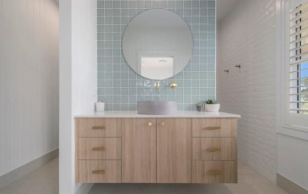 A Bathroom with A Sink, Mirror and Wooden Cabinets | Mid-North Coast, NSW | BDM Constructions