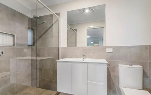 A Bathroom with A Toilet , Sink , Mirror and Walk in Shower | Mid-North Coast, NSW | BDM Constructions
