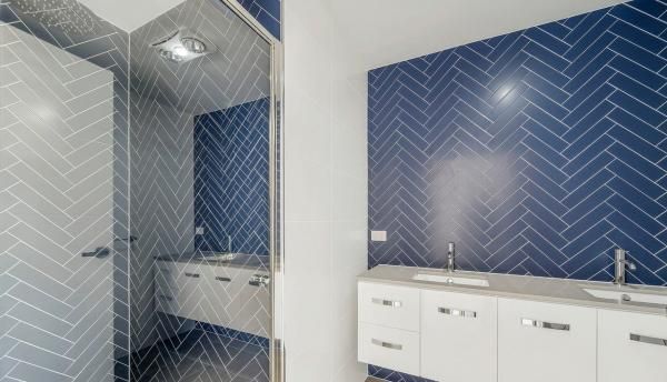A Bathroom with Blue and White Tiles and A Sink | Mid-North Coast, NSW | BDM Constructions