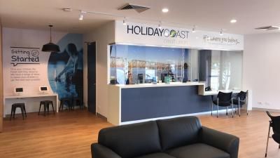 A Living Room with A Couch and A Counter in A Hotel | Mid-North Coast, NSW | BDM Constructions