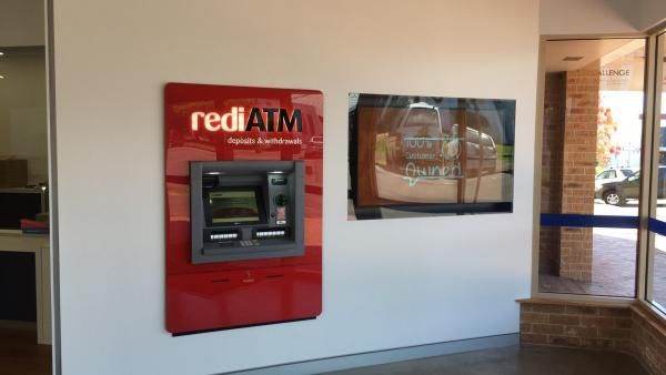 A Red Atm Machine Is Mounted on A White Wall | Mid-North Coast, NSW | BDM Constructions