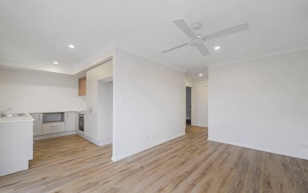 There Is a Ceiling Fan in The Room and A Kitchen in The Background | Mid-North Coast, NSW | BDM Constructions