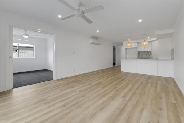 A Living Room with Hardwood Floors and A Ceiling Fan | Mid-North Coast, NSW | BDM Constructions