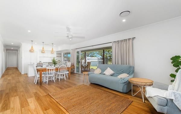 A Living Room with A Couch, Chairs, Table and Rug | Mid-North Coast, NSW | BDM Constructions