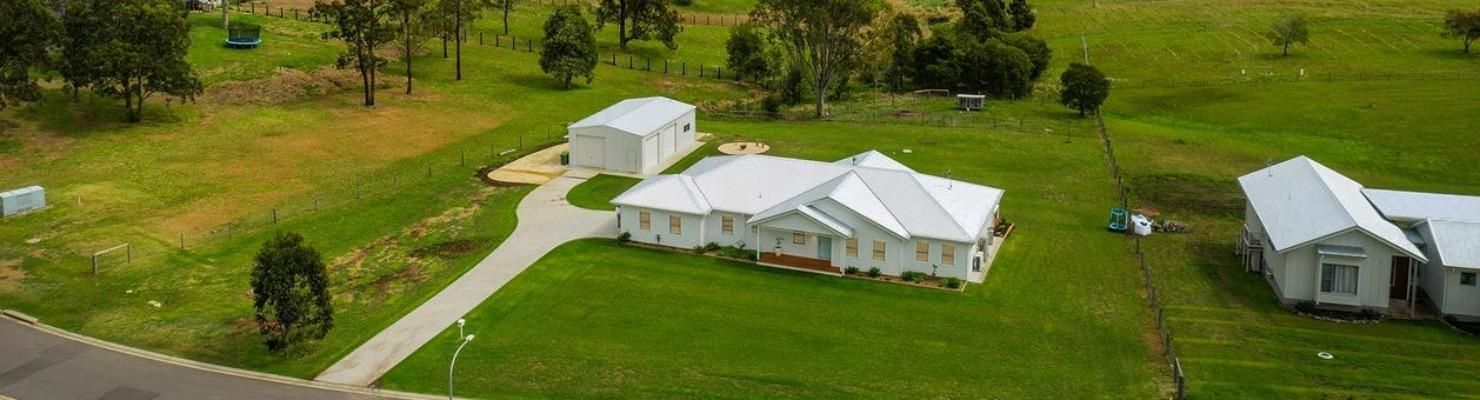 An Aerial View of A Residential Area with Houses and Trees | Mid-North Coast, NSW | BDM Constructions
