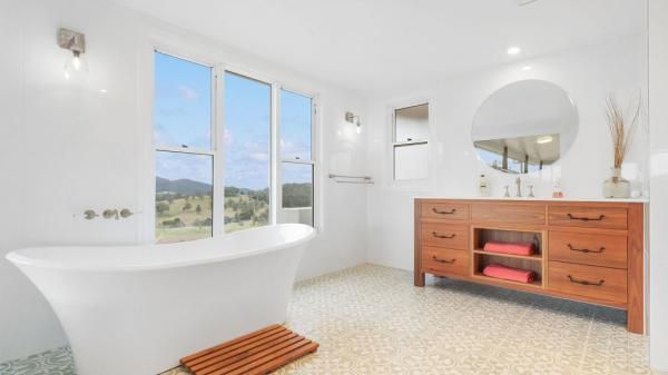 A Bathroom with A Tub, Sink, Mirror and Window | Mid-North Coast, NSW | BDM Constructions