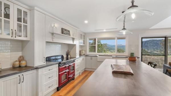 A Kitchen with White Cabinets and A Large Island in The Middle | Mid-North Coast, NSW | BDM Constructions