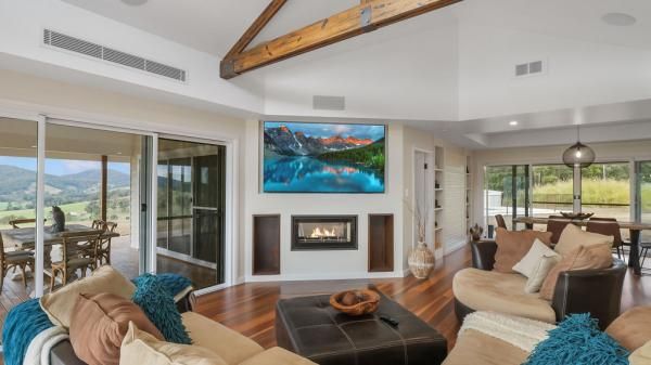 A Living Room with A Fireplace and A Flat Screen Tv on The Wall | Mid-North Coast, NSW | BDM Constructions