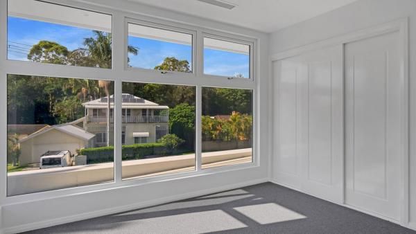An Empty Room with A Large Window and A View of A House | Mid-North Coast, NSW | BDM Constructions