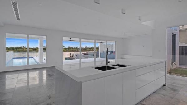 An Empty Kitchen with A Large Island and Two Sinks | Mid-North Coast, NSW | BDM Constructions