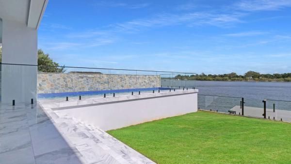 A View of A Lake from A Balcony of A House | Mid-North Coast, NSW | BDM Constructions