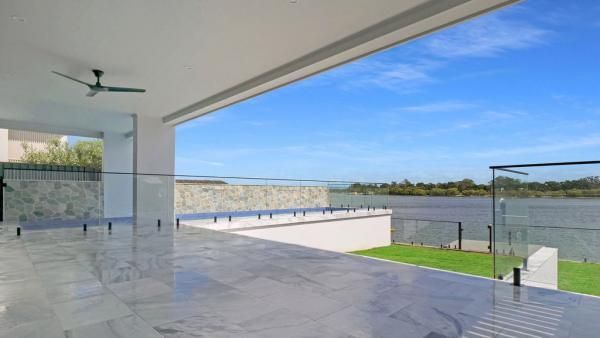 A Balcony with A View of A Body of Water and A Ceiling Fan | Mid-North Coast, NSW | BDM Constructions
