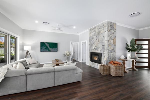 A Living Room with A Couch and A Fireplace | Mid-North Coast, NSW | BDM Constructions