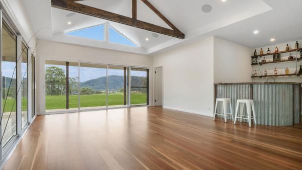 A Large Empty Room with Hardwood Floors and A Bar | Mid-North Coast, NSW | BDM Constructions