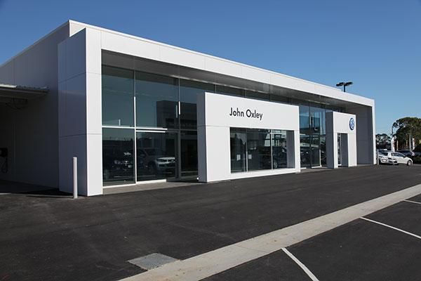 A Car Dealership with A Parking Lot in Front of It | Mid-North Coast, NSW | BDM Constructions