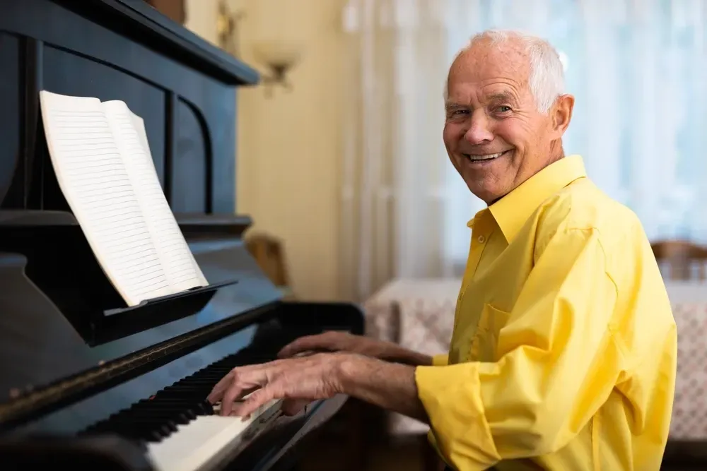 grown man learning to play piano