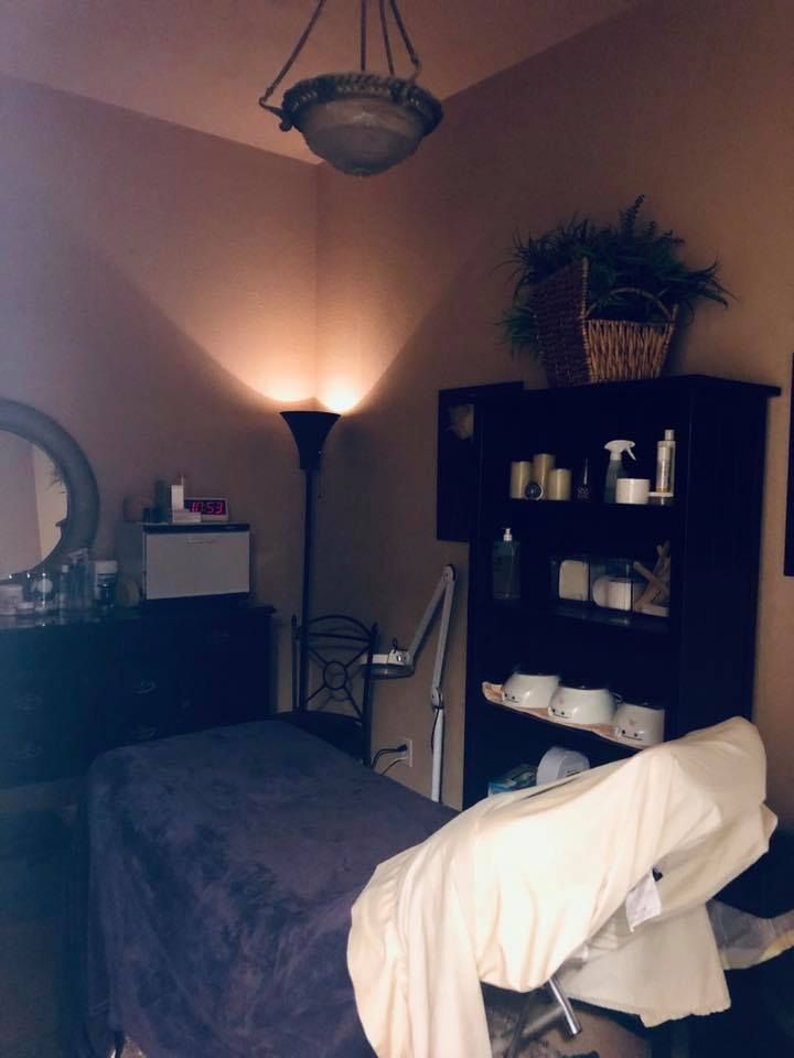 A room with a bed and a chair in it