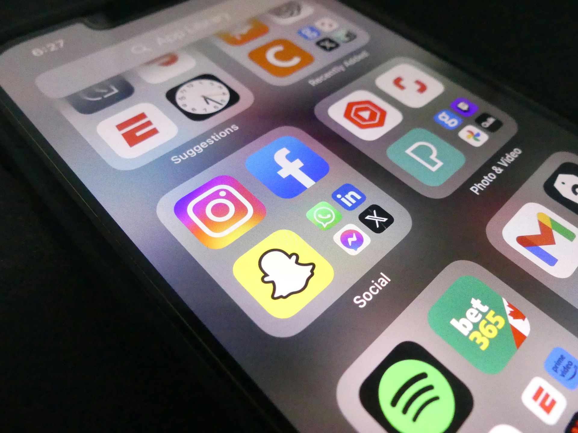 A phone showing app and social media icons