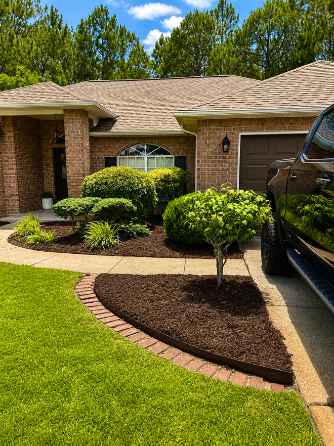 Freshly mulched garden bed with clean edge