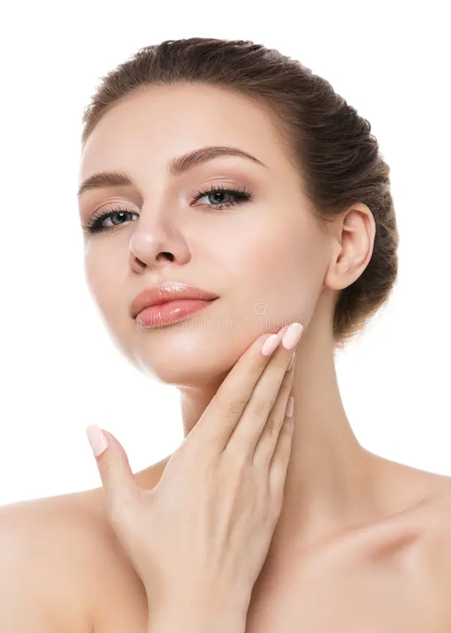 Woman touching her neck, looking at the camera, with light makeup and a white background.