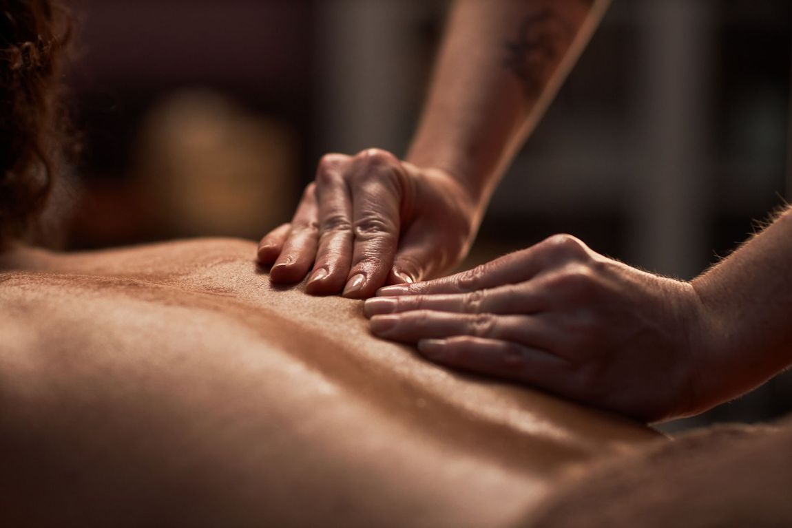 Massage therapist applying therapeutic bodywork techniques in Pittsfield MA
