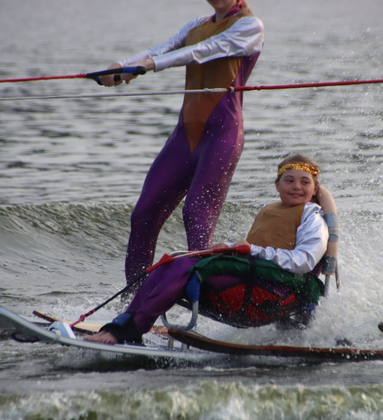 A girl with down syndrome adaptive water skiing