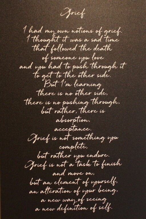 Handwritten poem in white ink on dark brown paper background