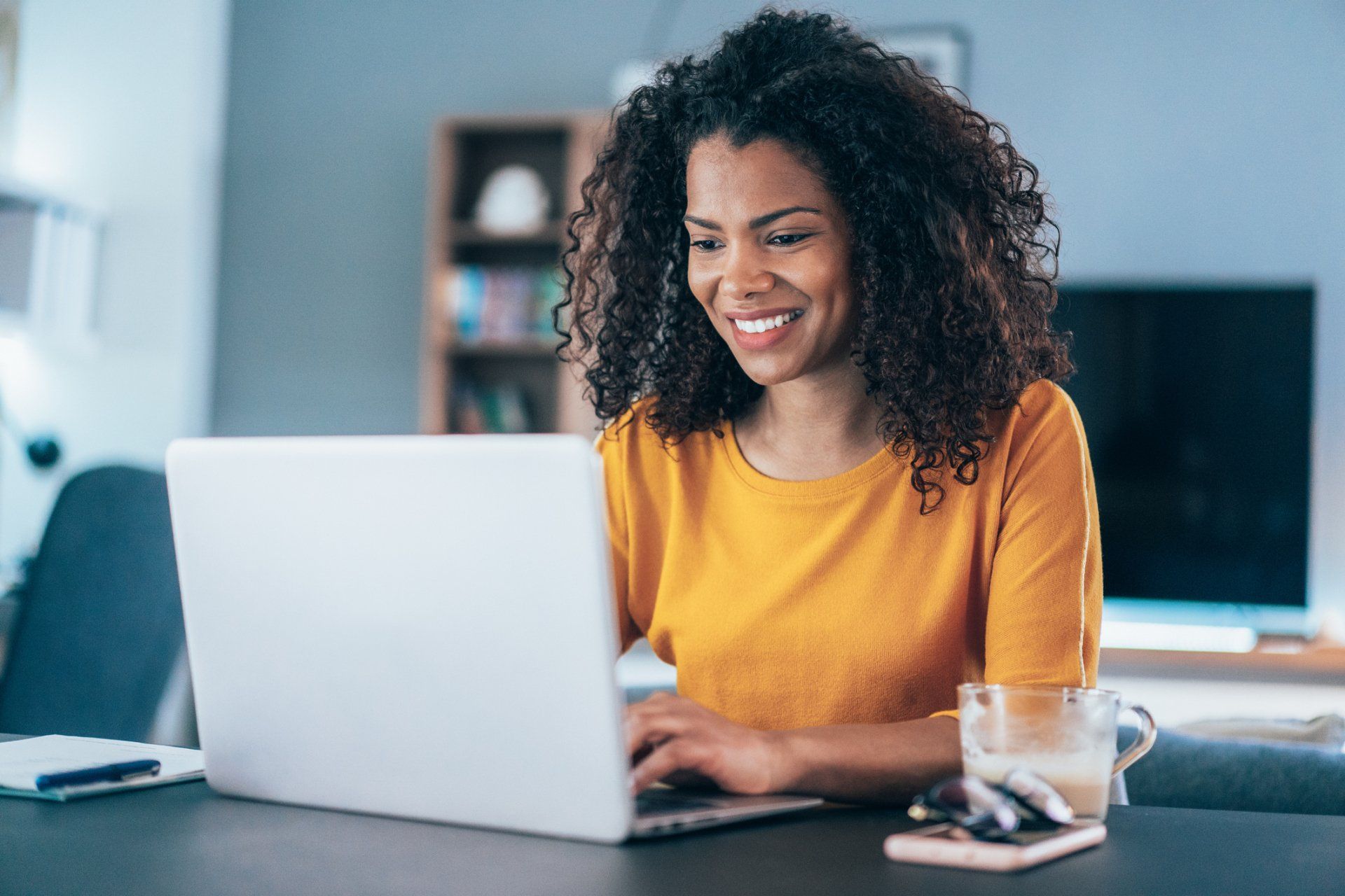 Woman Looking at Her Laptop — Melville, NY — All Access Financial