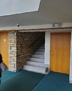 There are stairs leading up to the second floor of a building.