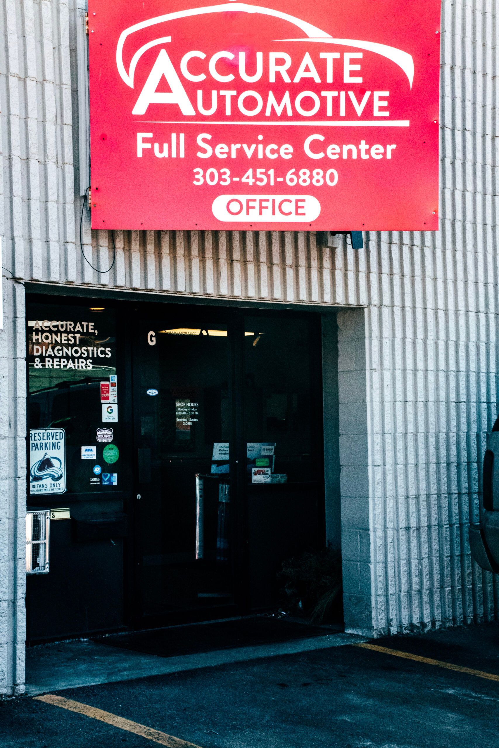 Accurate Automotive service center entrance with red sign and open doorway | Accurate Automotive Northglenn