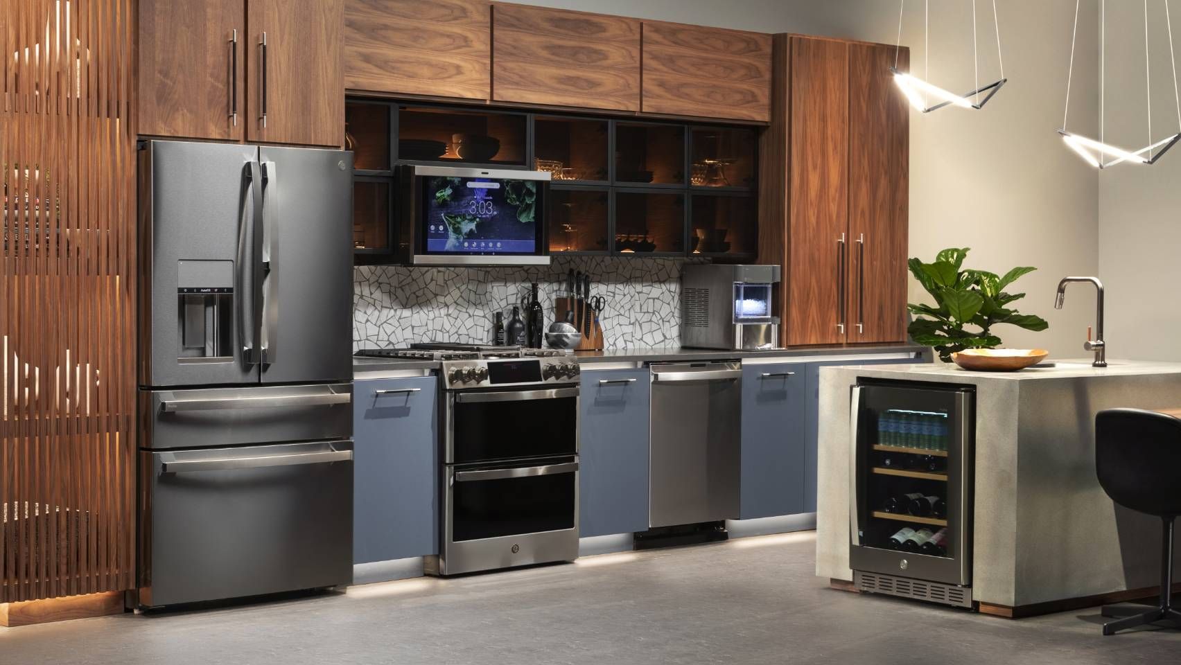 a kitchen with stainless steel appliances and wooden cabinets