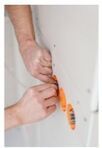 Picture of a electrical repair man, making home electrical repairs.