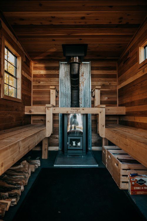 There is a wood stove in the middle of the room.